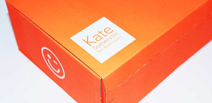 A bright orange eCommerce box with white logos