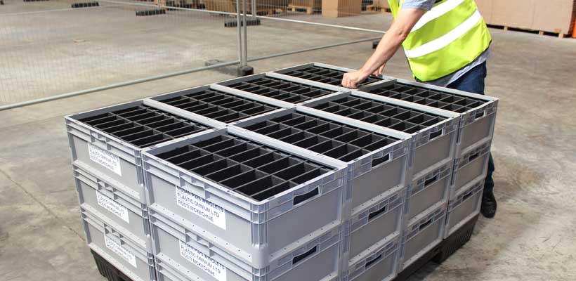 Reusable packaging on a pallet in a warehouse