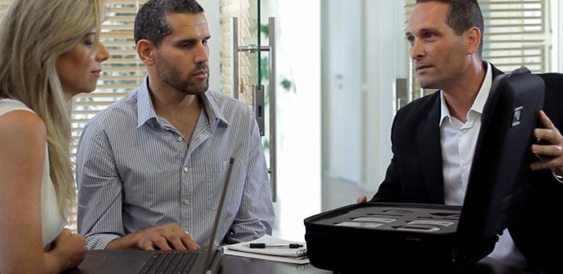 Sample cases Three people in a sales meeting with a sample case