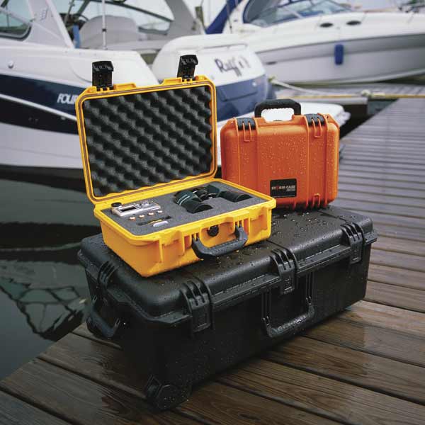 Waterproof packaging cases on wooden jetty