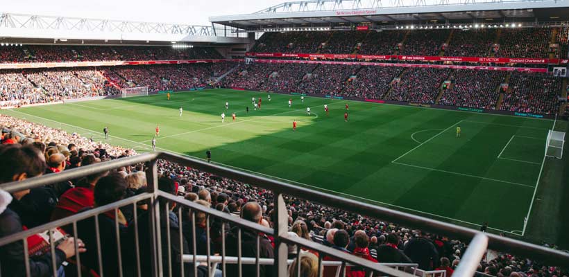 Football kit skip A football match in a full stadium.