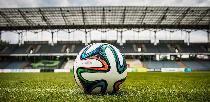 Sports storage solutions A football in an empty stadium.