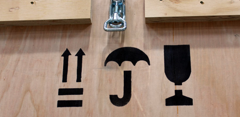 Handling symbols Handling symbols on a wooden crate.
