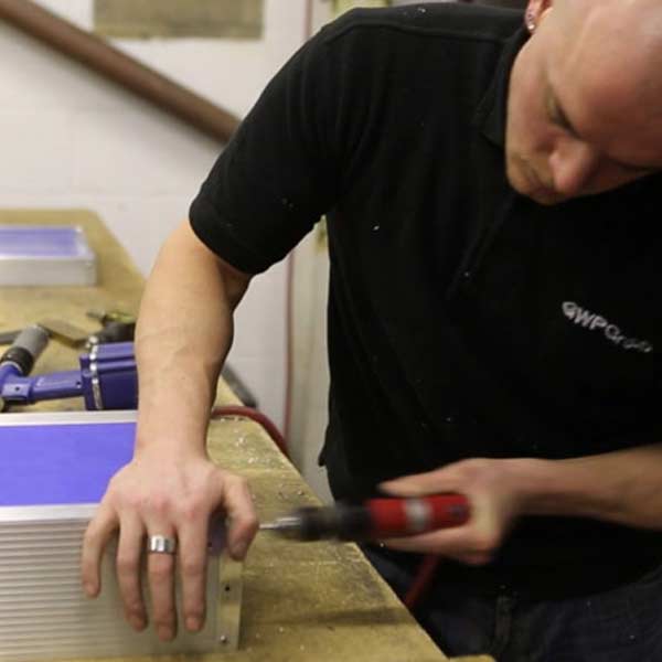 Custom case manufacturers A person manufacturing a custom case.