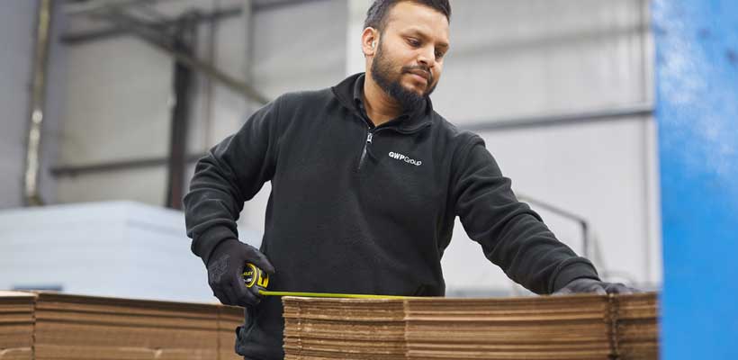 Local packaging suppliers A person working at a local packaging supplier.