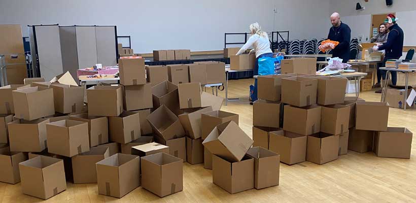 Empty boxes at the Marmalade Trust, ready to be turned into festive hampers.