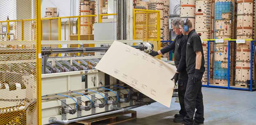 Vegan packaging manufactures Two people working at a vegan packaging manufacturer