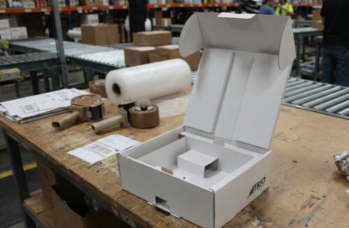 Postal packaging supplies on a packing bench