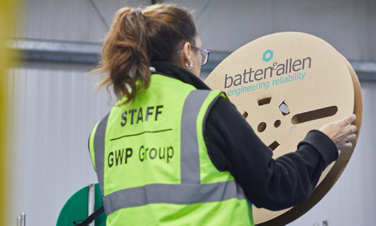 Plastic reel alternative A person holding a cardboard spool