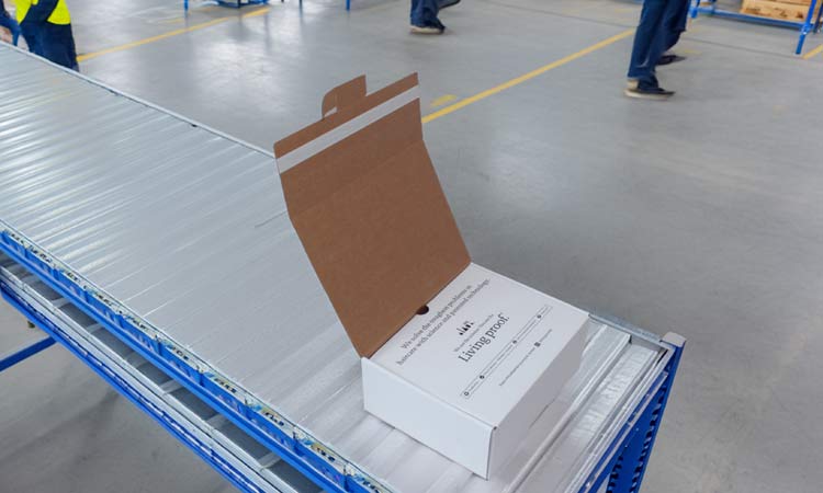 A self seal box on a packing line in a fulfilment centre.