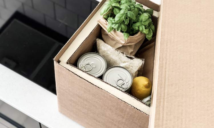 Temperature controlled packaging Temperature controlled packaging containing food on a kitchen counter