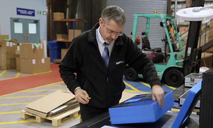 A GWP packaging expert inspecting a foam insert