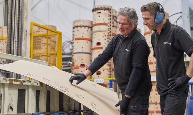 Two people working at a packaging manufacturer