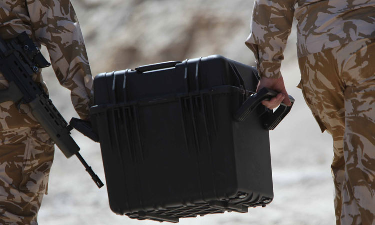 Tracker case Military personnel carrying a GWP tracker case