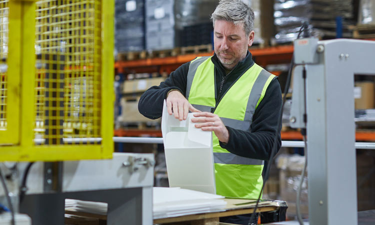 A person assembling packaging at GWP Group