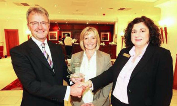 Wilts Life Business of the year David Pedley and Ruth Cook recieving the Wiltshire Life Business of the Year award