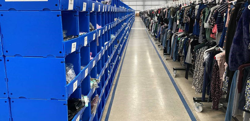 Correx picking bins Correx picking bins containing clothes in a warehouse.