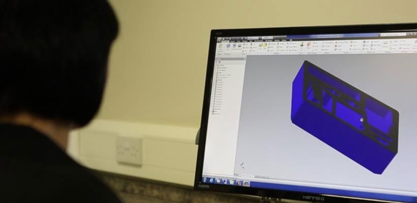 A designer creating custom foam inserts using 3D CAD software