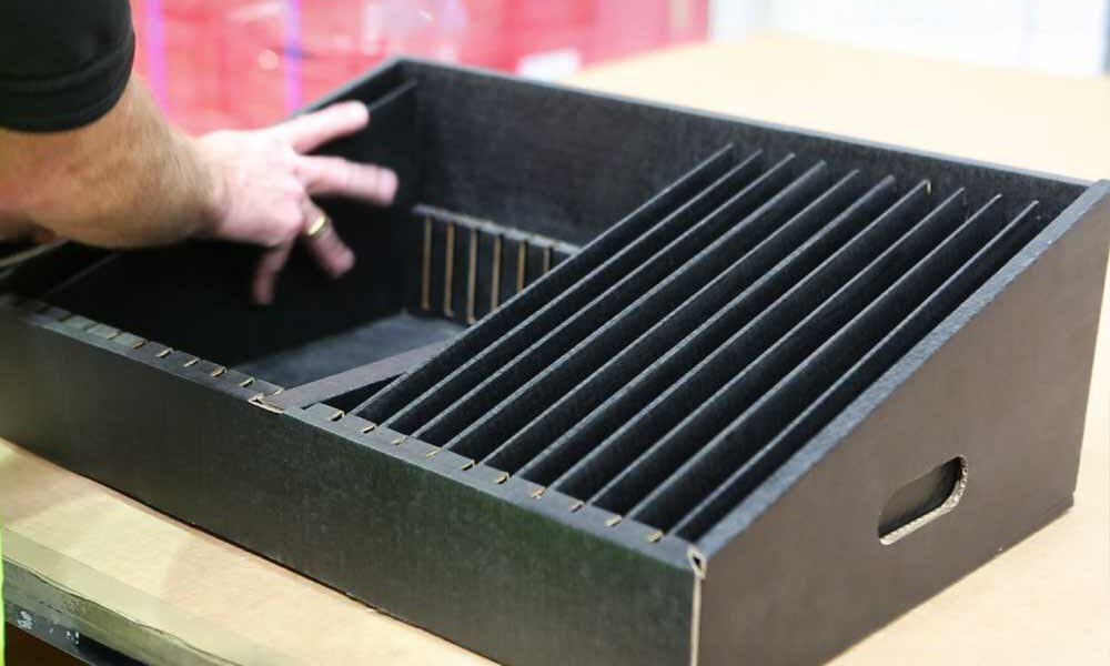 A person assembling a conductive reel rack