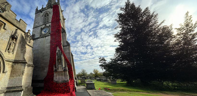 Poppies knitted by and donated to Peacock WI displayed on the church in Corsham.