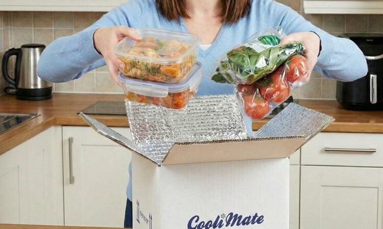 A person opening temperature controlled packaging containing food in a kitchen
