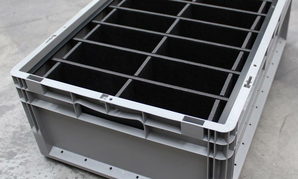 Container inserts Container inserts inside a Euro box on the floor of a warehouse