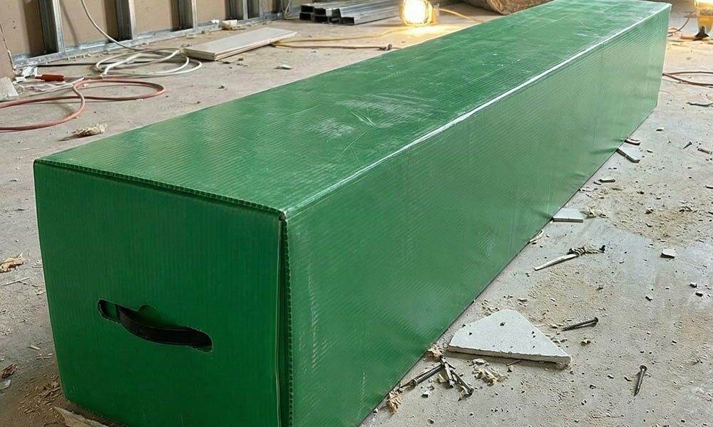 A fluorescent tube container on the floor of a part renovated office building