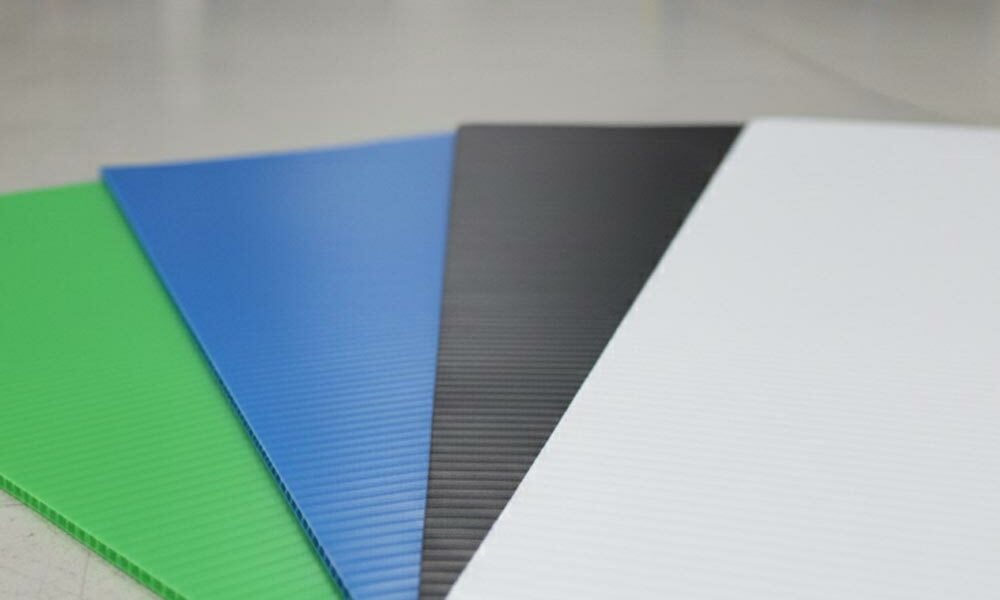 Several plastic boards on the floor of a warehouse